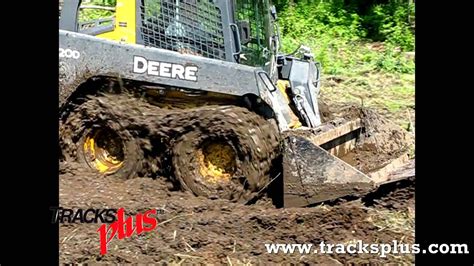 wheeled skid steer in mud|skid steer tracks stuck.